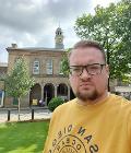 Councillor Damien Greenhalgh with the Town Hall in the background