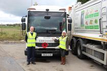 AES Operations Manager Dean Wilson and Councillor Jean Todd with a poppy-wearing vehicle.