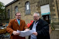 Councillors Damien Greenhalgh and Anthony Mckeown inspect plans for the Market Hall