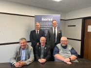 Andrew Stokes, Chief Executive of Staffordshire Moorlands District Council, and Justin Galliford, Chief Executive of the Norse Group (standing) with (seated L-R) Staffordshire Moorlands District Council Deputy Leader, Councillor Mark Deaville, and Leader,