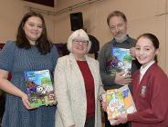 Photo of Marisa Wilkinson from AES, Councillor Jean Todd and Jason Taylor from AES presenting Emily Wentworth with her prize.