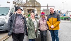 Photo of Councillors Anthony Mckeown and Damien Greenhalgh (left and right) with Buxton Markets CiC Director Caitlin Bisknell and Director and stall holder Bev Thompson.