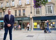 Councillor Damien Greenhalgh in front of the shops on Spring Gardens