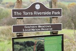 Photo of The Torrs Riverside Park sign - credit Visit Peak District and Derbyshire